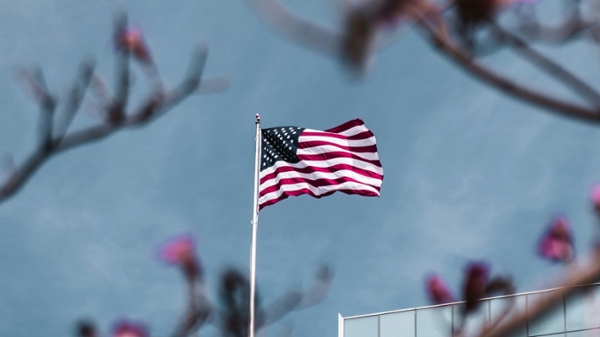 American flag flying in the wind. 